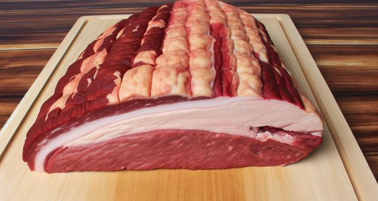 Whole raw brisket showing the point and flat sections before separation