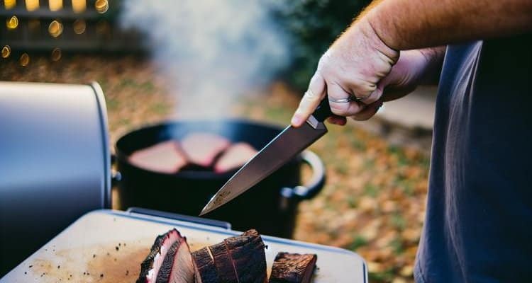 Slicing brisket against the grain with proper technique