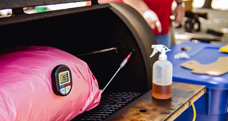 Wrapping competition brisket in pink butcher paper at 165 degrees