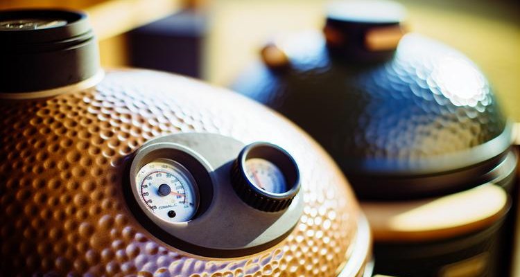 Close-up of kamado grill dome thermometer and ceramic construction showing temperature control precision