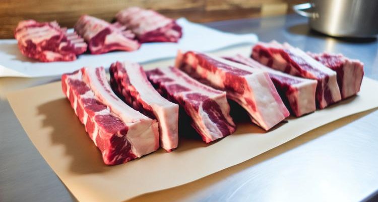 Raw beef short ribs showing thick meat coverage and marbling