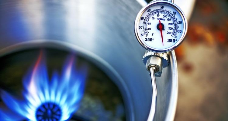 Deep fry thermometer showing 350°F oil temperature for turkey frying