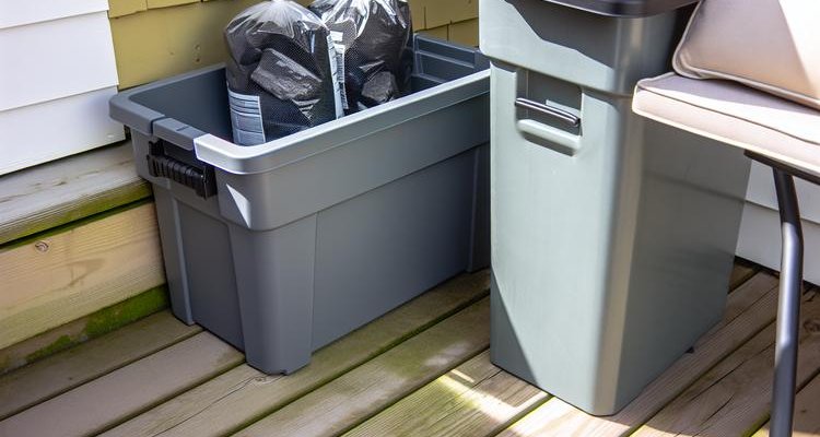 Weatherproof charcoal storage containers on outdoor patio