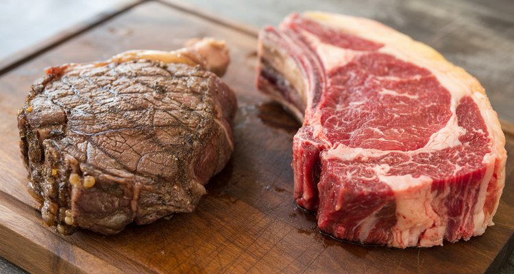 Dry-aged vs wet-aged steak comparison on cutting board