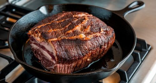 Smoked eye of round roast reverse searing in a cast iron skillet